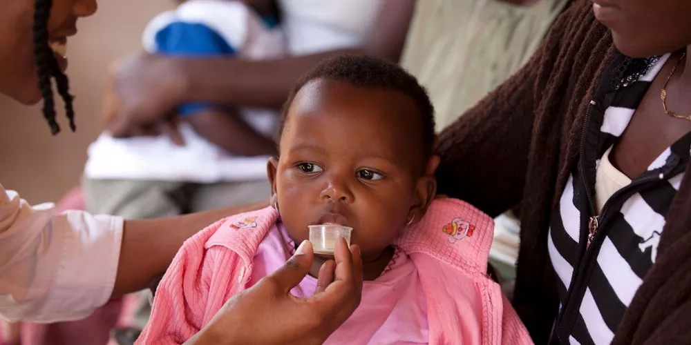 Child receives dispersible antimalarial treatment in Kenya Child receives dispersible antimalarial treatment in Kenya
