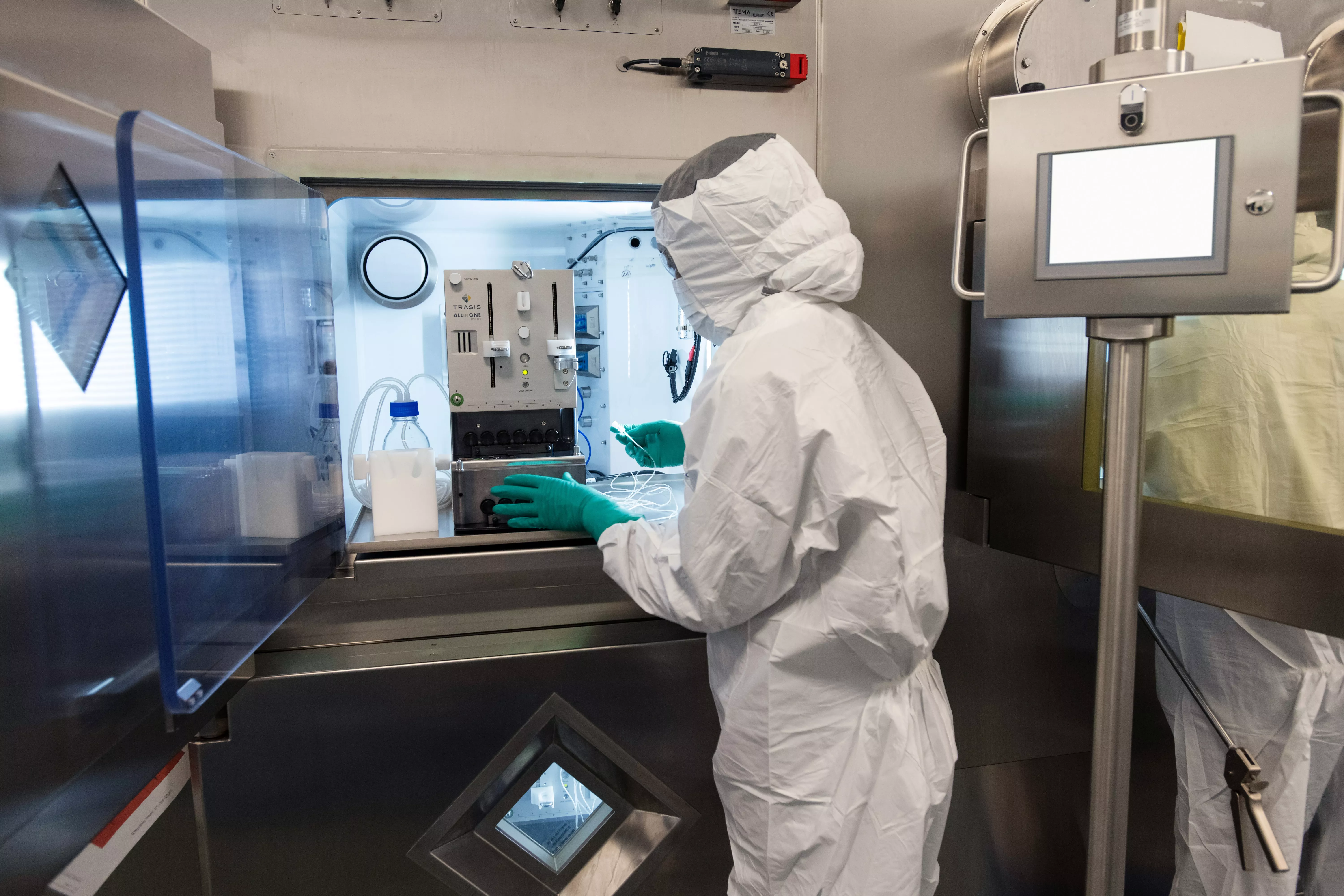 Associate in full personal protective equipment using specialized equipment Associate in full personal protective equipment using specialized equipment